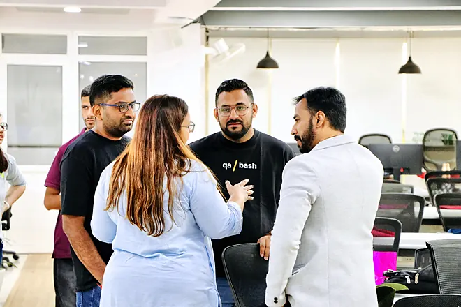 Attendees chatting at a QA Bash meetup