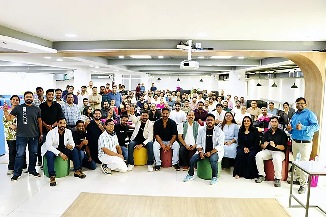 Full-room group photo at a QA Bash meetup
