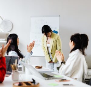 QA manager giving constructive feedback to junior tester after a production bug